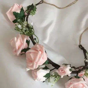 a flower crown of pale pink artificial rose flowers