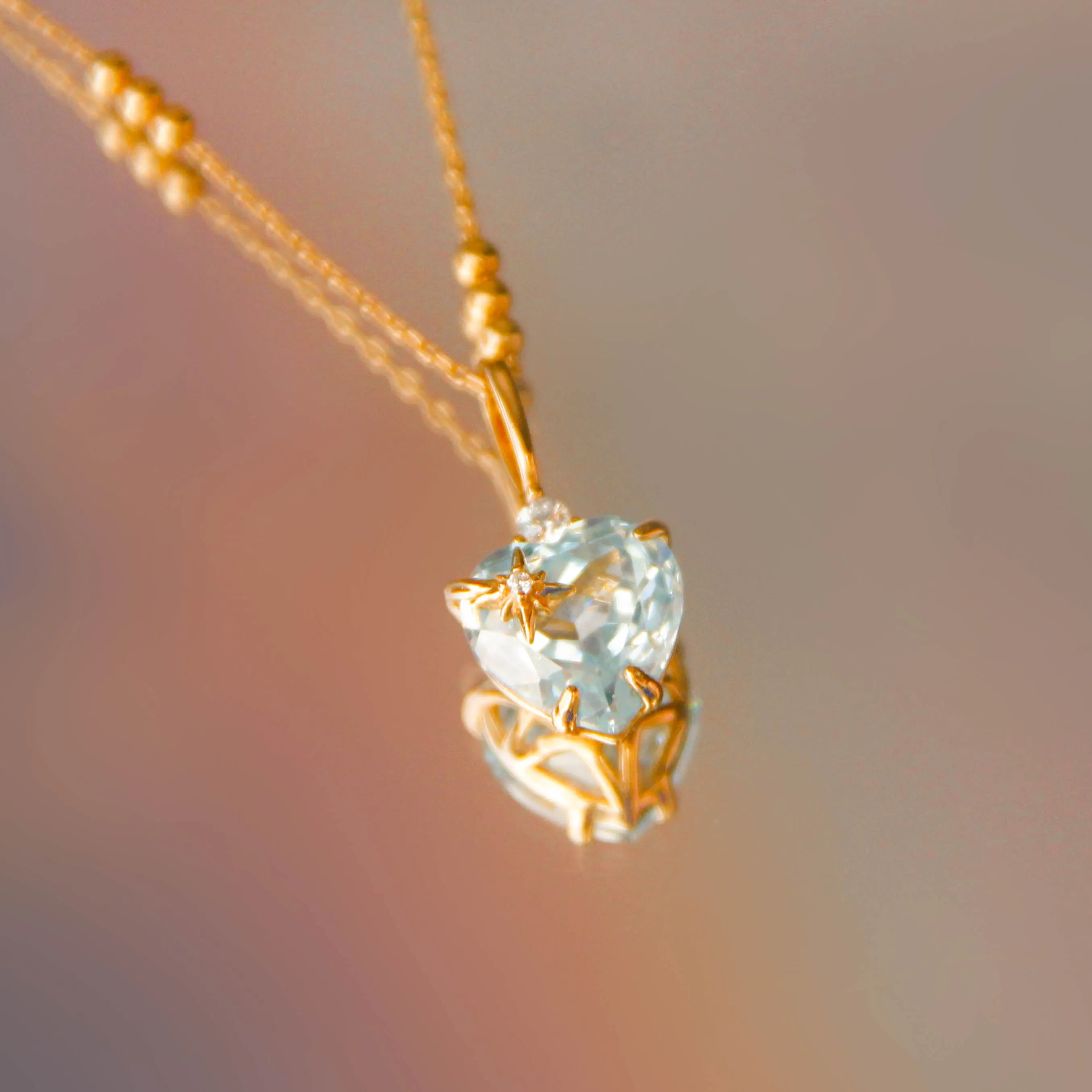 Blue Topaz Gold Heart Pendant